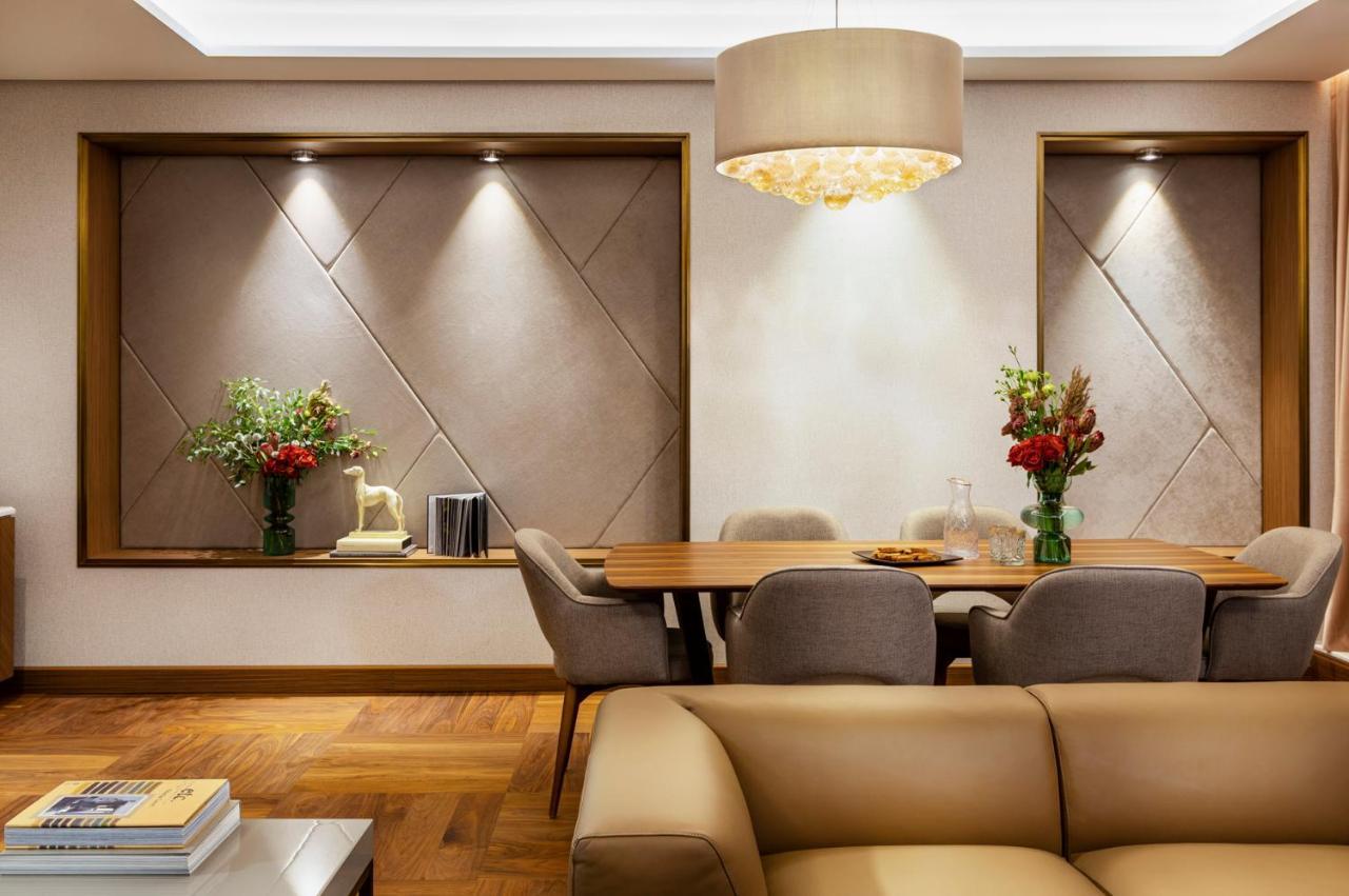 Grand Hotel Millennium 索菲亞 外观 照片 A living room with a dining table